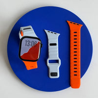 Bracelet Apple Watch sport en silicone, coloris bleu glacier et orange