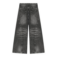Dos du jean wide leg femme noir délavé avec moustaches aux genoux