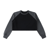 Sweat crop top femme raglan bicolore noir, vue de face