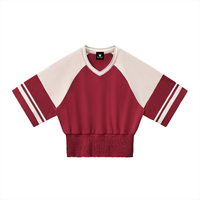 Packshot face du sweat crop raglan original femme rouge / abricot