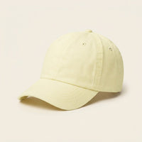 Casquette femme jaune pastel unie vue de trois quarts, coupe baseball