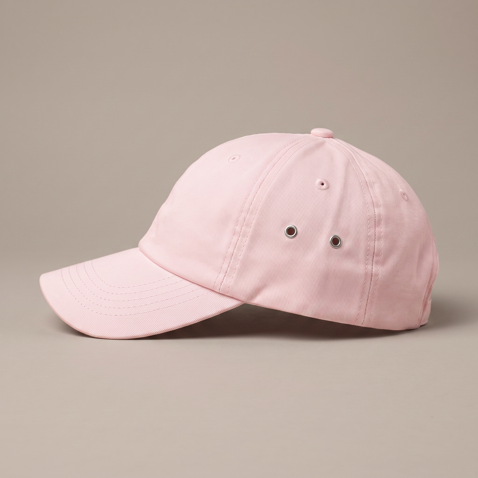 Casquette femme rose pastel de profil, visière incurvée
