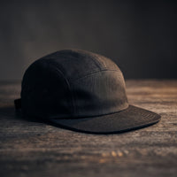 Casquette five panel noire unie, visière plate