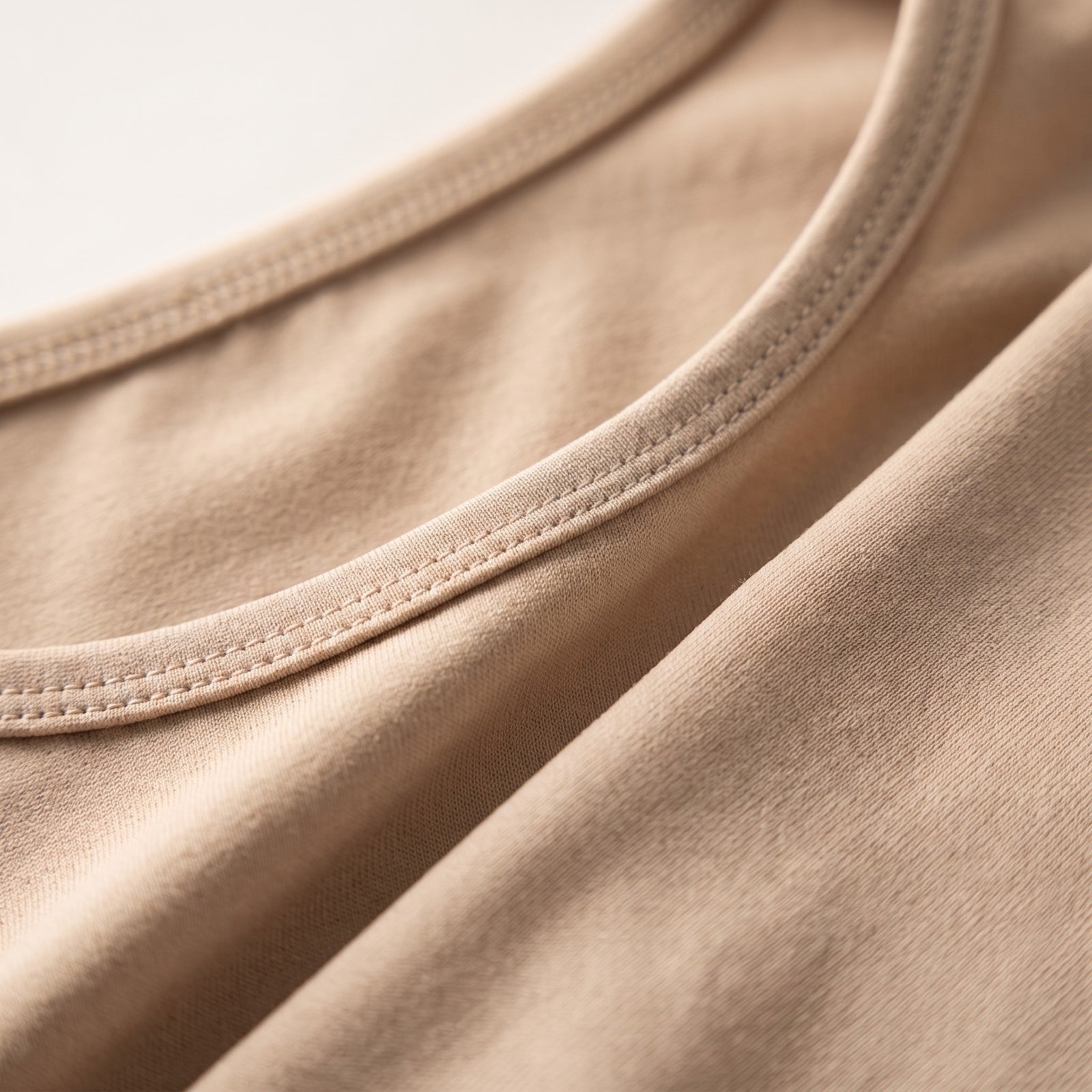Macro du tissu stretch nylon-élasthanne du boléro yoga beige