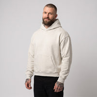 Hoodie boxy original bord brut gris avoine chiné porté par un mannequin CHT'M
