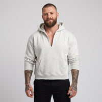 Hoodie boxy original bord brut gris avoine chiné à encolure fendue en V porté par un mannequin CHT'M