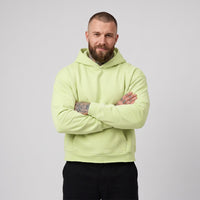 Hoodie boxy original bord brut vert clair porté par un mannequin CHT'M