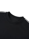 Détail de la bande contrastée à l'épaule du pull oversize CHT'M