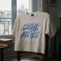 Gros plan du t-shirt boxy délavé Gen Z blanc cassé « L'avenir c'est nous » – CHT'M Boutique