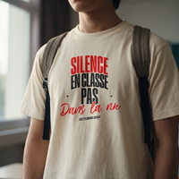 Gros plan du print « Silence en classe, pas dans la rue » sur t-shirt crème porté – CHT'M Boutique