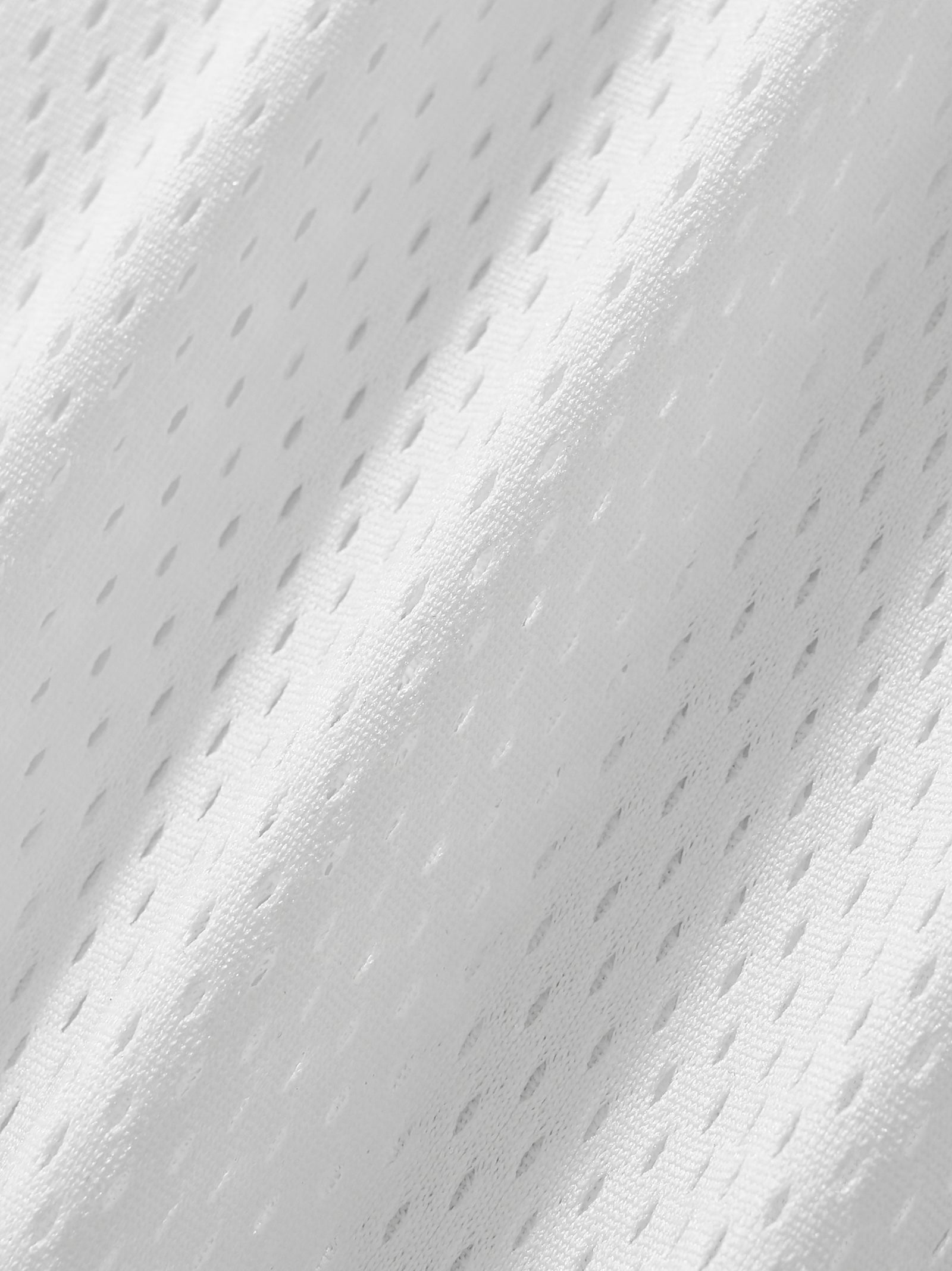 Texture de la maille mesh blanche du maillot DAD Beer - gros plan sur le filet ajouré et respirant