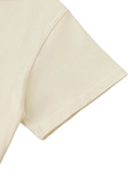 Manche courte du crop top femme abricot clair - détail de l'emmanchure et de la finition roulée