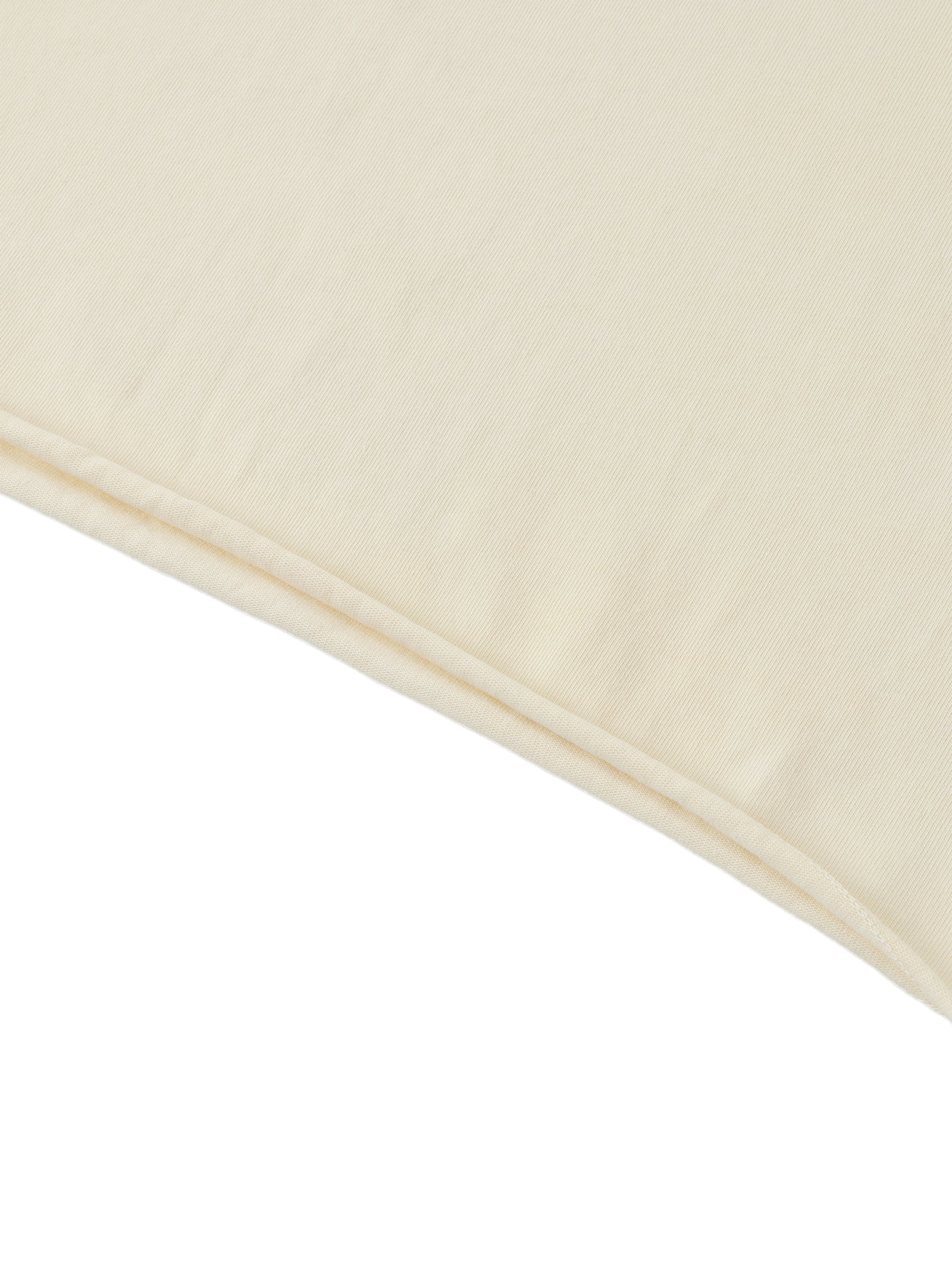 Ourlet roulé du crop top femme abricot clair - bas laissé brut qui roulotte naturellement
