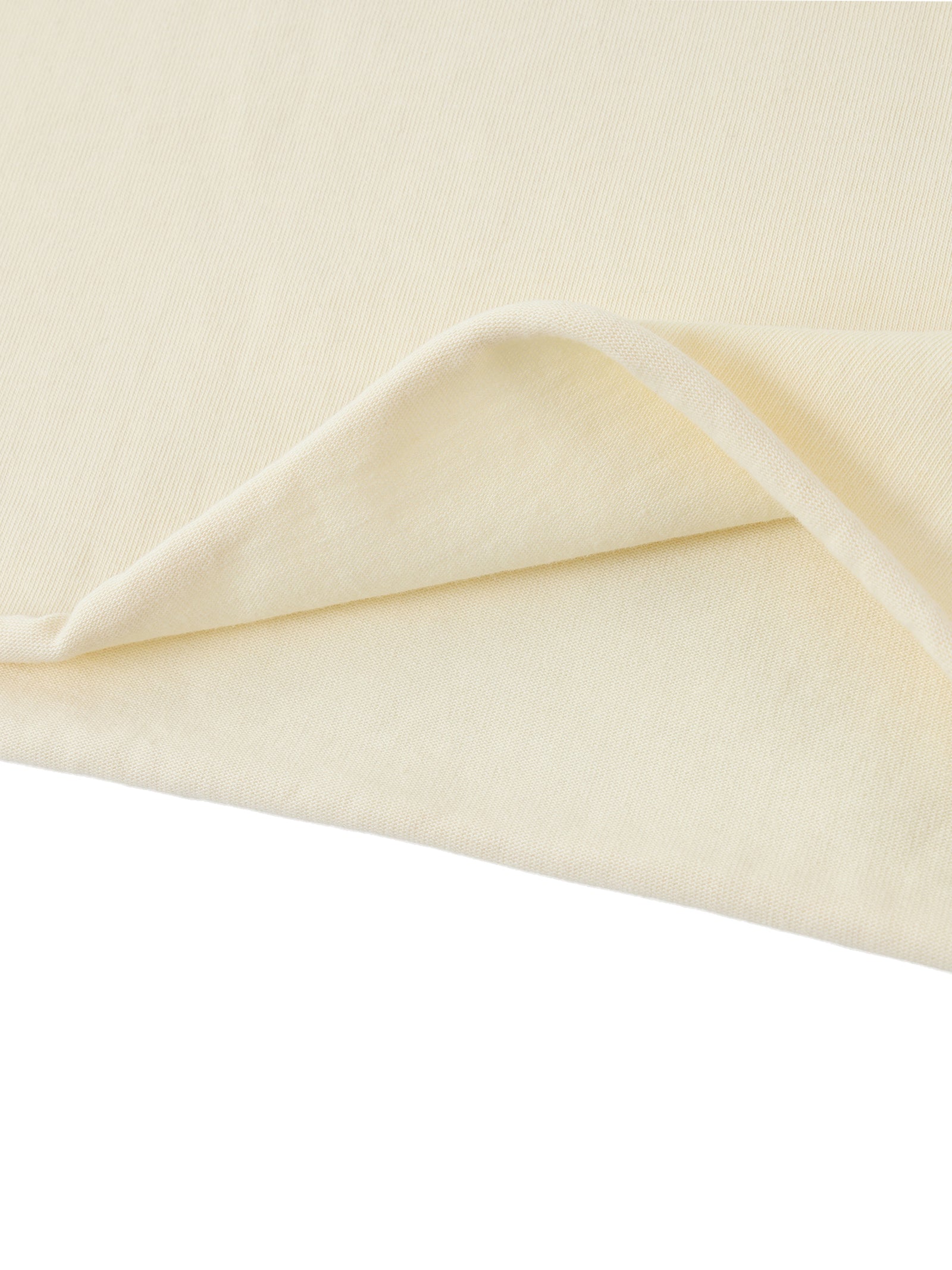 Tissu du crop top femme abricot clair plié - souplesse et légèreté du coton pour l'été