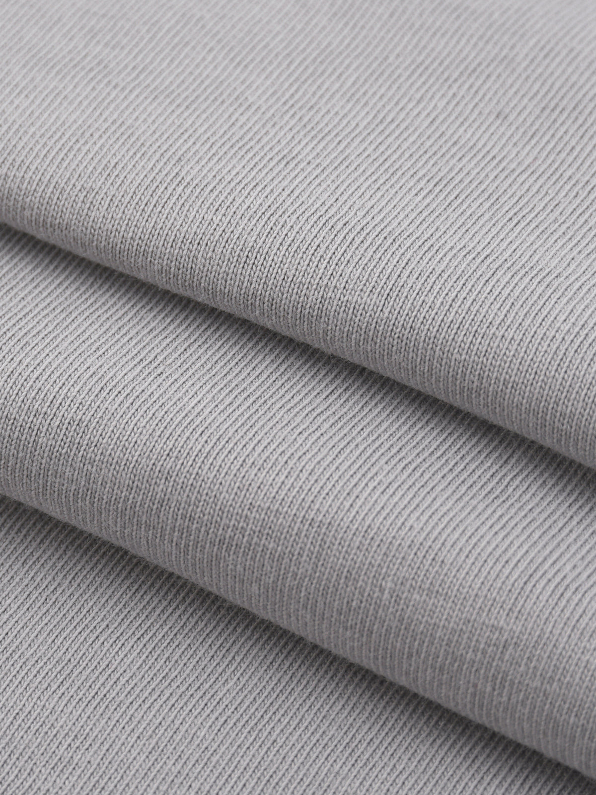 Coton plié du t-shirt enfant Mountain Expedition, gros plan sur la maille gris clair