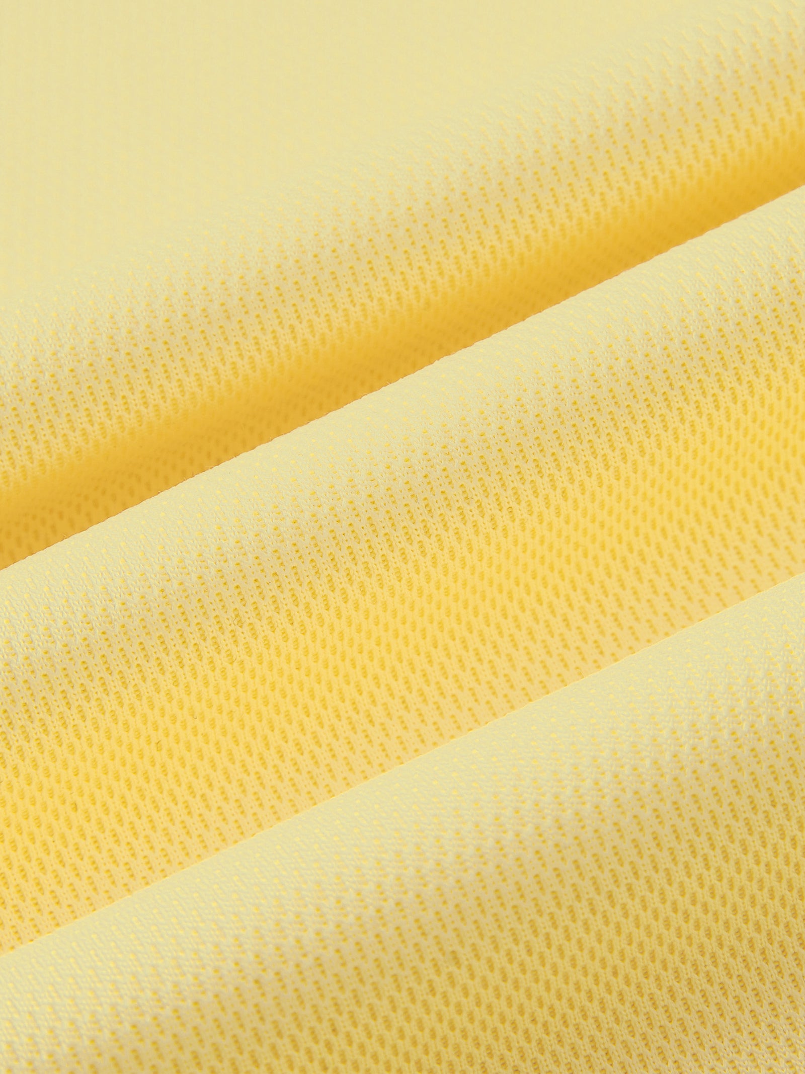 Texture de la maille jaune du maillot foot belge femme original, tissu respirant et léger