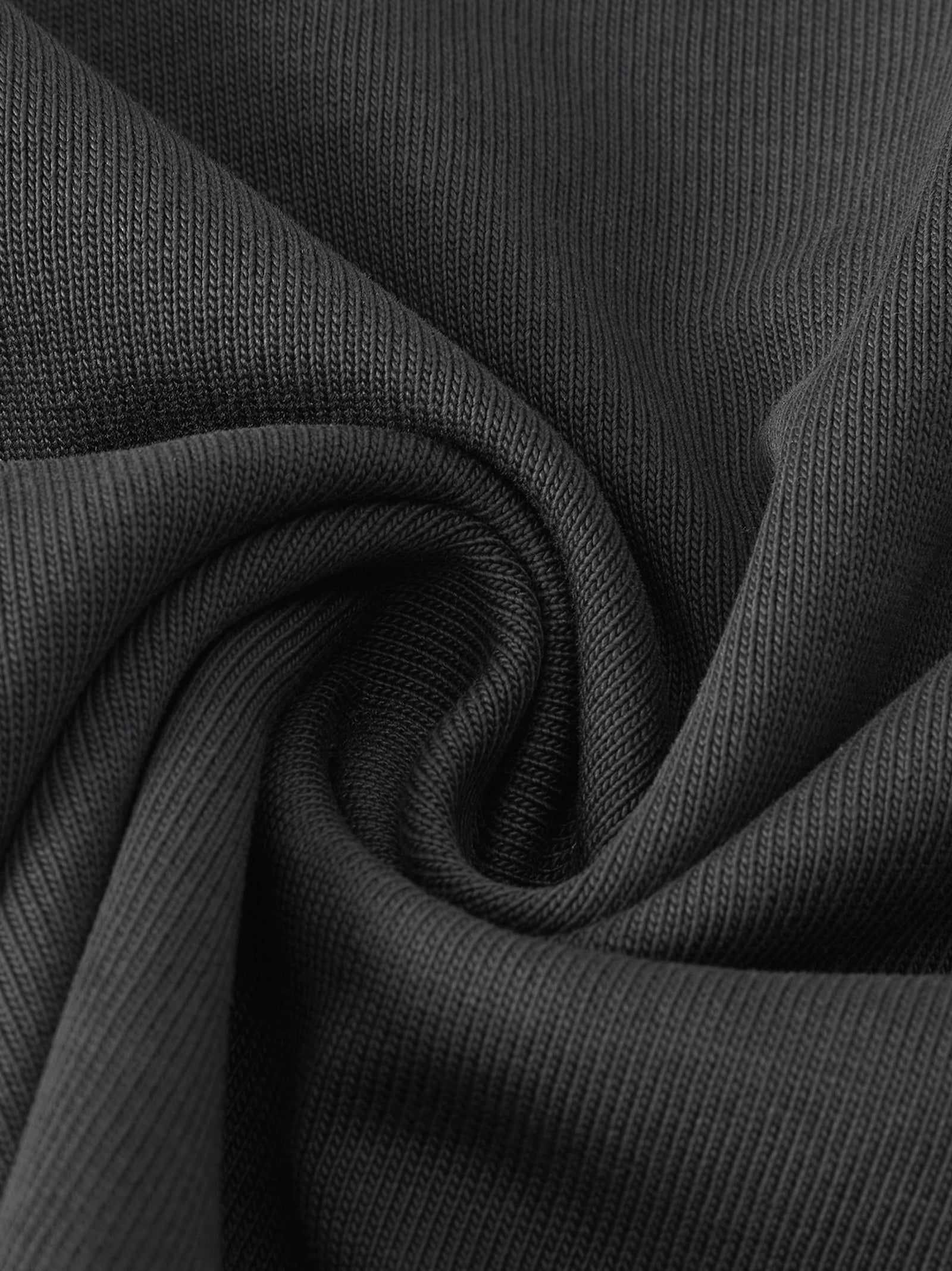Gros plan sur la maille du coton 400 g/m² du t-shirt belge oversized