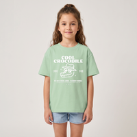 Fille en t-shirt enfant oversized Cool Crocodile vert amande, imprimé blanc crocodile à lunettes
