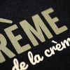 Macro de l'impression du design La Crème de la Crème sur le coton biologique du t-shirt