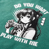 Gros plan sur l'impression manga noir et blanc de la gameuse a la manette sur le coton vert d'un t-shirt oversized