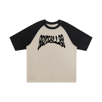 T-shirt oversized BRUXELLES en abricot clair - lettrage graffiti noir et épaules noires