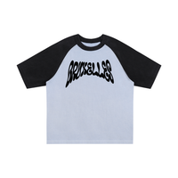 T-shirt oversized BRUXELLES en bleu clair - imprimé graffiti noir et découpe raglan