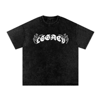 T-shirt oversized LEGACY en noir délavé vu de face - lettrage gothique et mains squelettiques